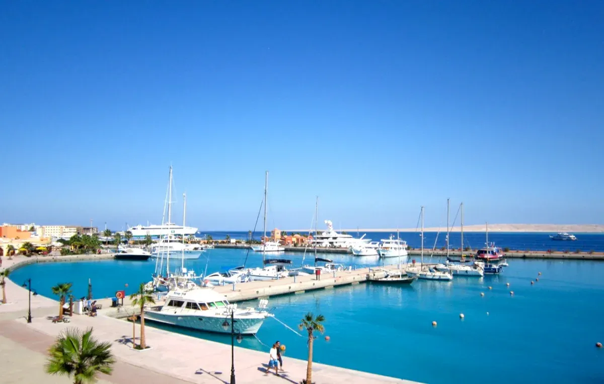 Yachts moored in the turquoise water of a marina on a luxury Egypt tour, Hurghada, Red Sea, Egypt